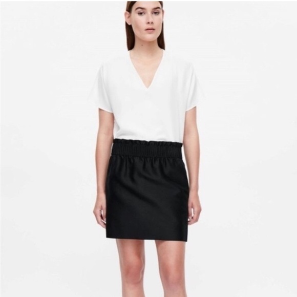 COS Dresses & Skirts - COS Black Mini Skirt. Elastic waistband with two side pockets.